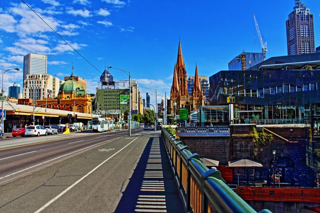 On the streets of Melbourne looking towards Federation Square and Flinders Street Station